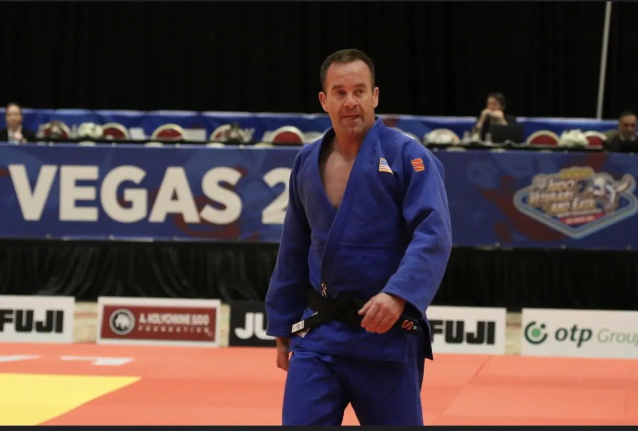 Billy Gavigan competing in a blue judo gi