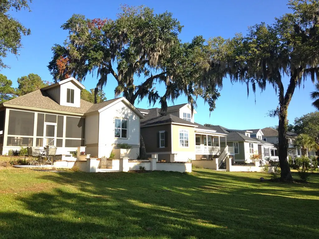 Completed Lowcountry homes beneath moss-draped live oaks in Sommer Lake Place